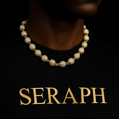 Necklace with small gold‑tone spheres distributed along the chain.